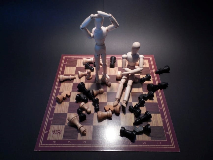 chess with stick figures standing on it