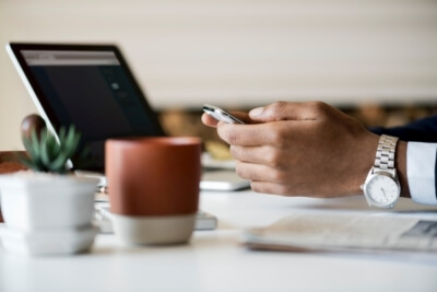 coffee with hands using smart phone